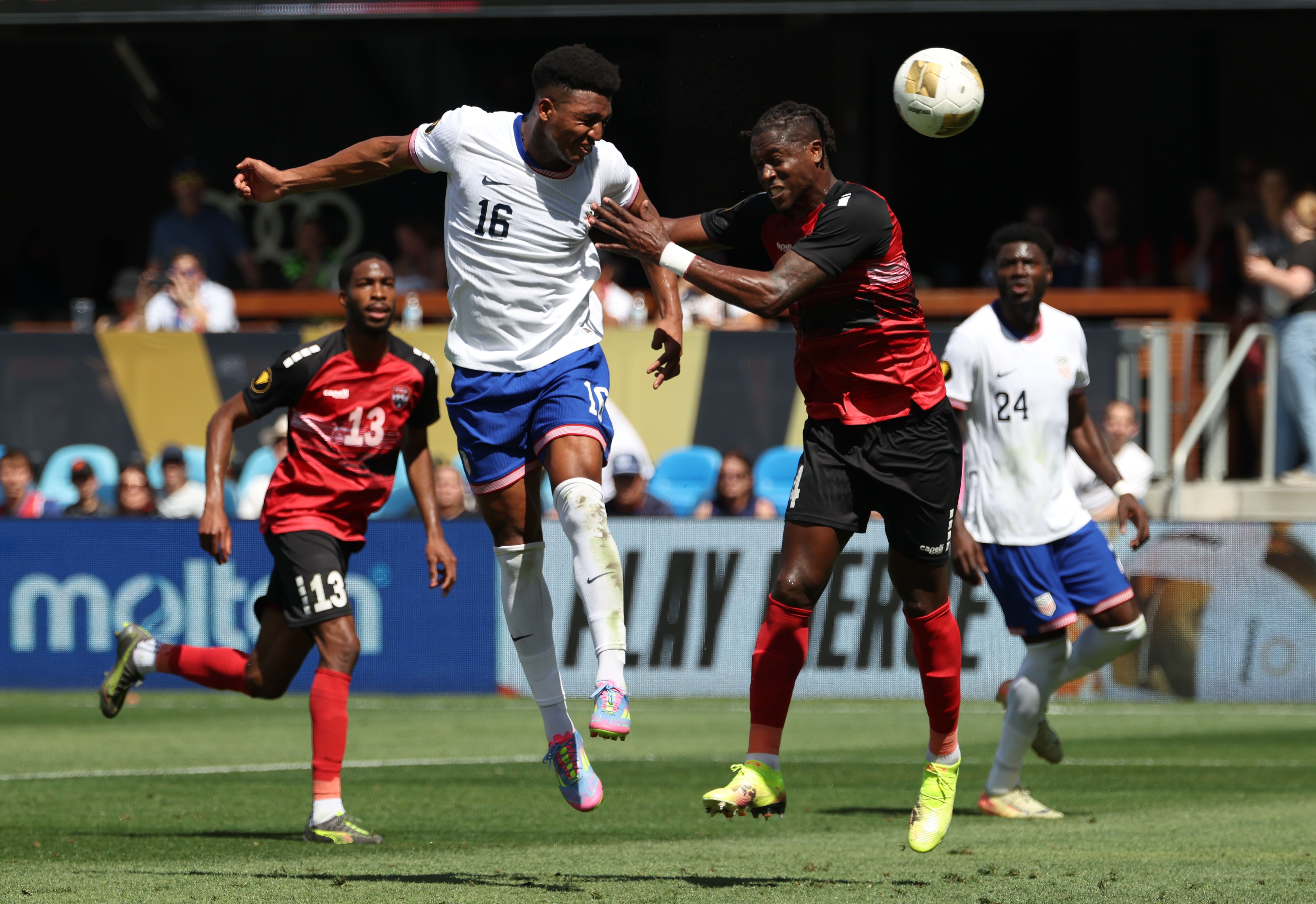 Alexander Freeman #16 of the United States battles Sheldon Bateau #4 of Trinidad and Tobago during the Gold Cup 2025 on Sunday in San Jose, Calif. The U.S. defeated Trinidad and Tobago to snap a four-game losing streak as it eyes next year