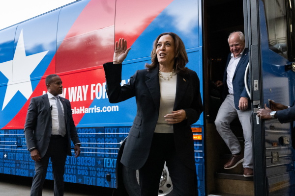Vice President Harris and Minn. Gov. Tim Walz disembark from their campaign bus in Savannah, Ga., on Aug. 28, 2024, as they travel across Georgia for a 2-day campaign bus tour. (Photo by SAUL LOEB / AFP) (Photo by SAUL LOEB/AFP via Getty Images)