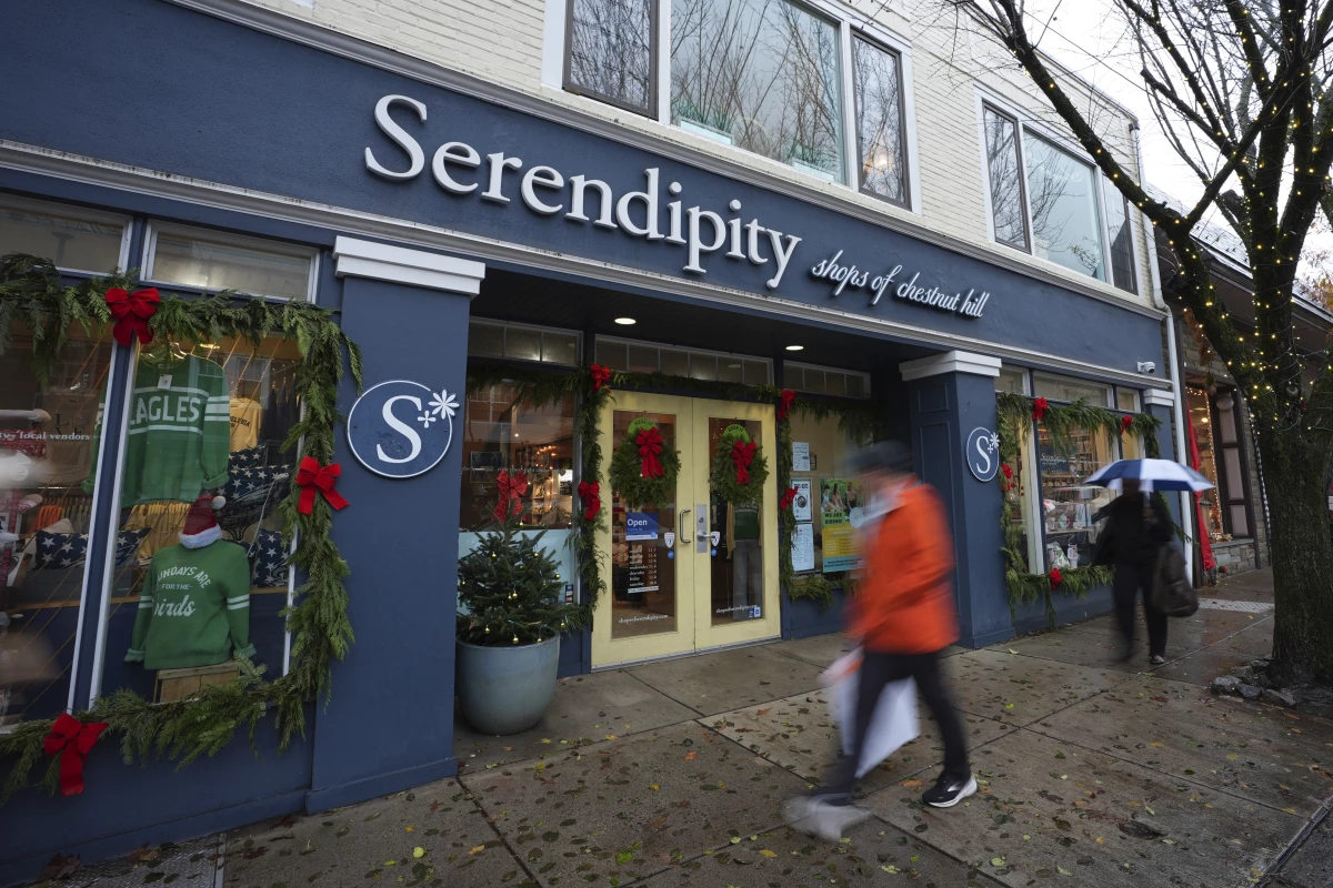 People walk past shops on Dec. 11 in Philadelphia.