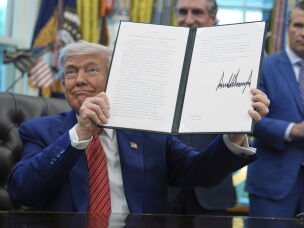 President Trump displays an executive order regarding nuclear reactor testing in the Oval Office of the White House on May 23, 2025. The executive order stipulates that the president hopes to see reactors online by July 4 of this year.