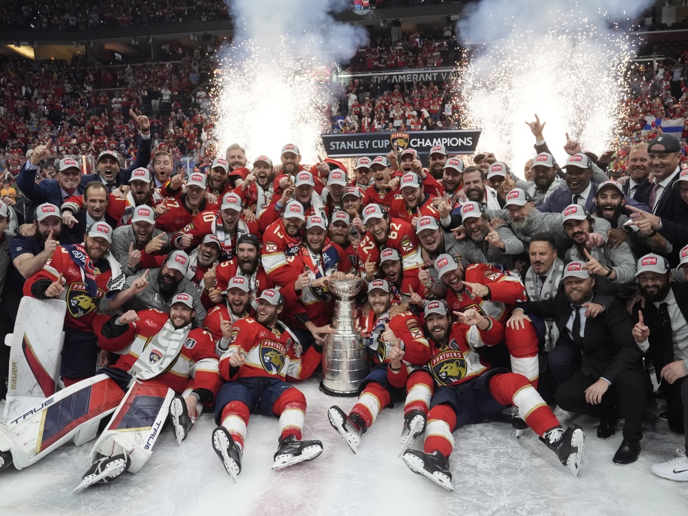The Florida Panthers team poses with the Stanley Cup trophy after defeating the Edmonton Oilers in Game 7 of the NHL hockey Stanley Cup Final, on Monday in Sunrise, Fla. The Panthers defeated the Oilers 2-1.  (AP)