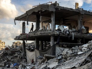 A man stands in a destroyed building in the Jabalia camp for Palestinian refugees in the northern Gaza Strip on Oct. 20, 2026.