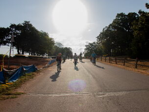 Will Rogers Elementary students cruise down a hill on their route to school after a routine brake check. Parents, students and a car monitor ride about a mile from the park to the school as part of what's called a bike bus.
