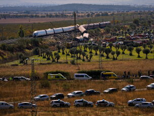 Emergency services work at the scene of a collision between two trains in Urda, Spain, on Wednesday, Oct. 28, 2026.