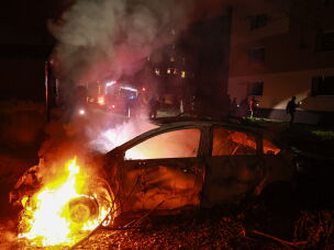 A car burns after a Russian airstrike on a residential neighborhood in Zaporizhzhia, Ukraine, on Saturday.