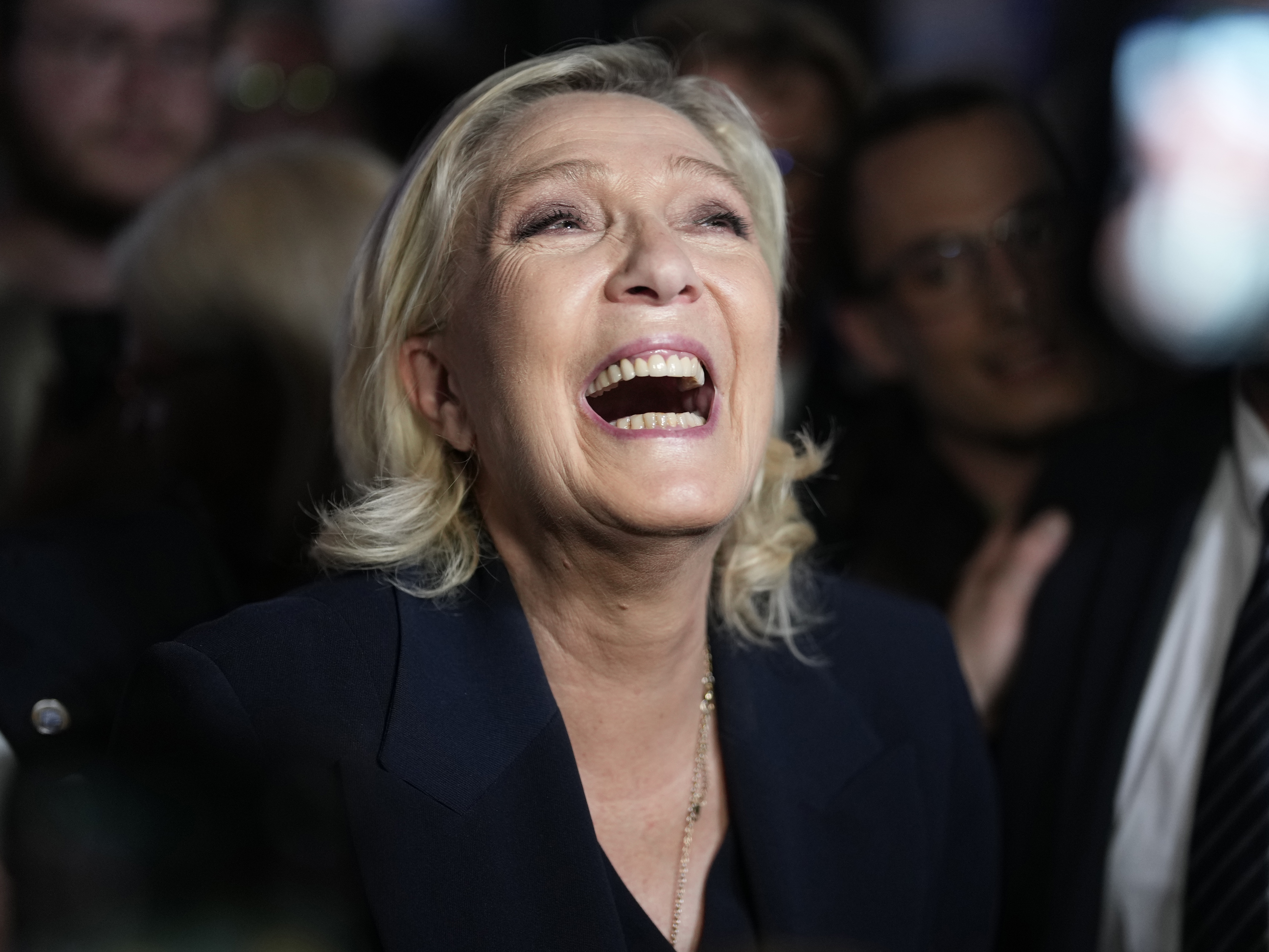 French far right leader Marine Le Pen reacts as she meets supporters and journalists after the release of projections based on the actual vote count in select constituencies on Sunday in Henin-Beaumont, northern France. 