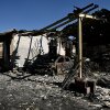 This photograph shows the building of a painting company destroyed by a wildfire in a business park in Biscarrosse, southwestern France on July 28, 2026.