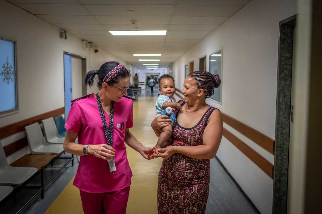 Jacqui Thake, senior research nurse at Stellenbosch University, interacts with Abigail Hendricks and her son Hayden, at the Tygerberg Hospital in Cape Town, South Africa. Hendricks benefitted from the use of an experimental new drug for pre-eclampsia, which is currently undergoing trials at Tygerberg.