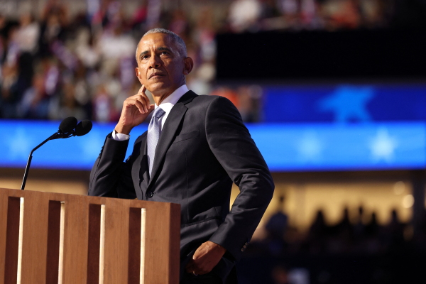 Former President Barack Obama gestures as he speaks on the second day of the Democratic National Convention in Chicago. Obama and his wife, Michelle Obama, spoke in support of Harris Tuesday night.