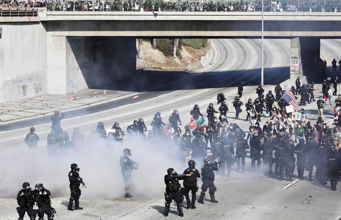 LOS ANGELES, CALIFORNIA - JUNE 08: California Highway Patrol (CHP) officers clear protestors who were blocking the 101 freeway on June 08, 2025 in Los Angeles, California. Tensions in the city remain high after the Trump administration called in the National Guard against the wishes of city leaders following two days of clashes with police during a series of immigration raids. More protests are scheduled for today. (Photo by Mario Tama/Getty Images)