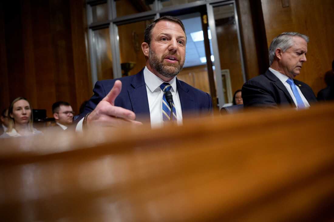 Sen. Markwayne Mullin, R-Okla., (left), speaks during a Senate Health, Education, Labor and Pensions Committee hearing on last month.