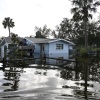 Floodwaters surround a home in the aftermath of Hurricane Helene on Friday in Crystal River, Fla.