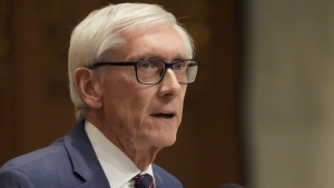 Wisconsin Gov. Tony Evers speaks at the state Capitol in Madison in early 2025. Evers, who won't seek another term in office, is seeking a constitutional amendment that would ban partisan gerrymandering in the state.
