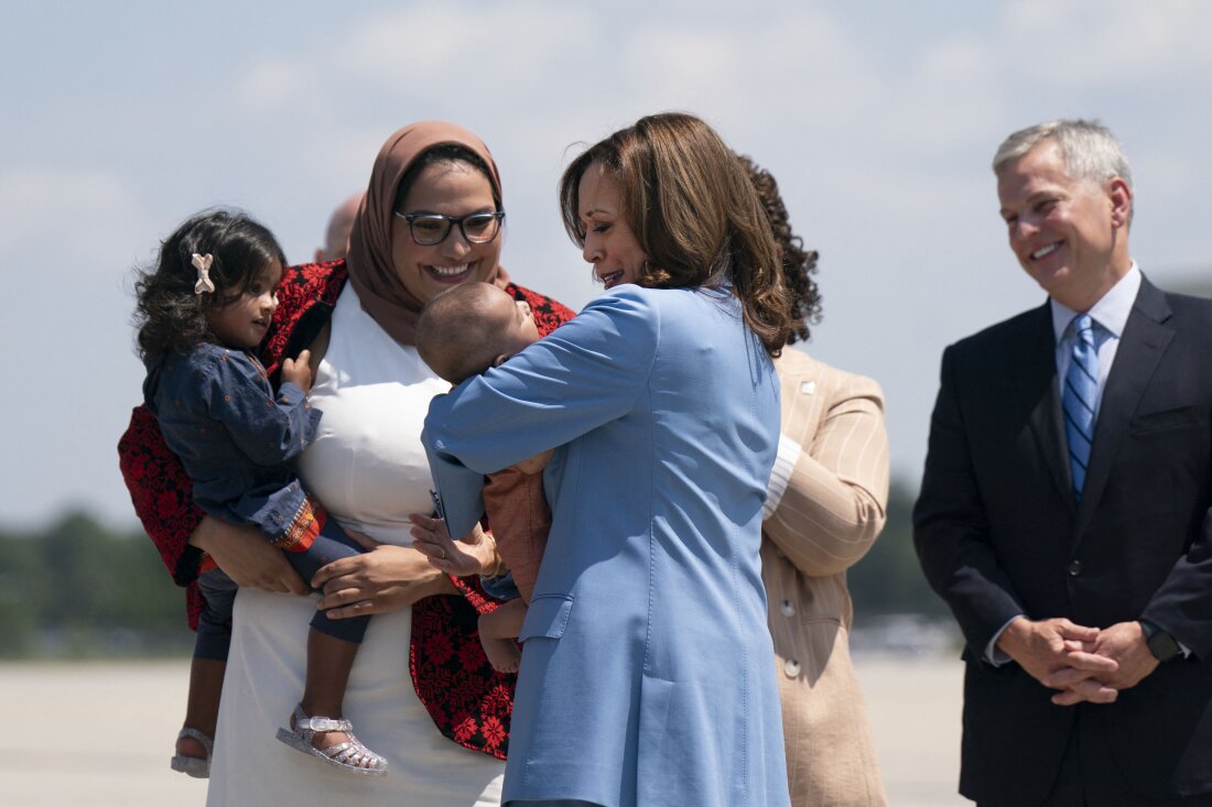 Vice President Harris holds the baby of Durham County Board of Commissioners chair Nida Allam upon arrival at Raleigh-Durham International Airport in North Carolina on Aug. 16, 2024.