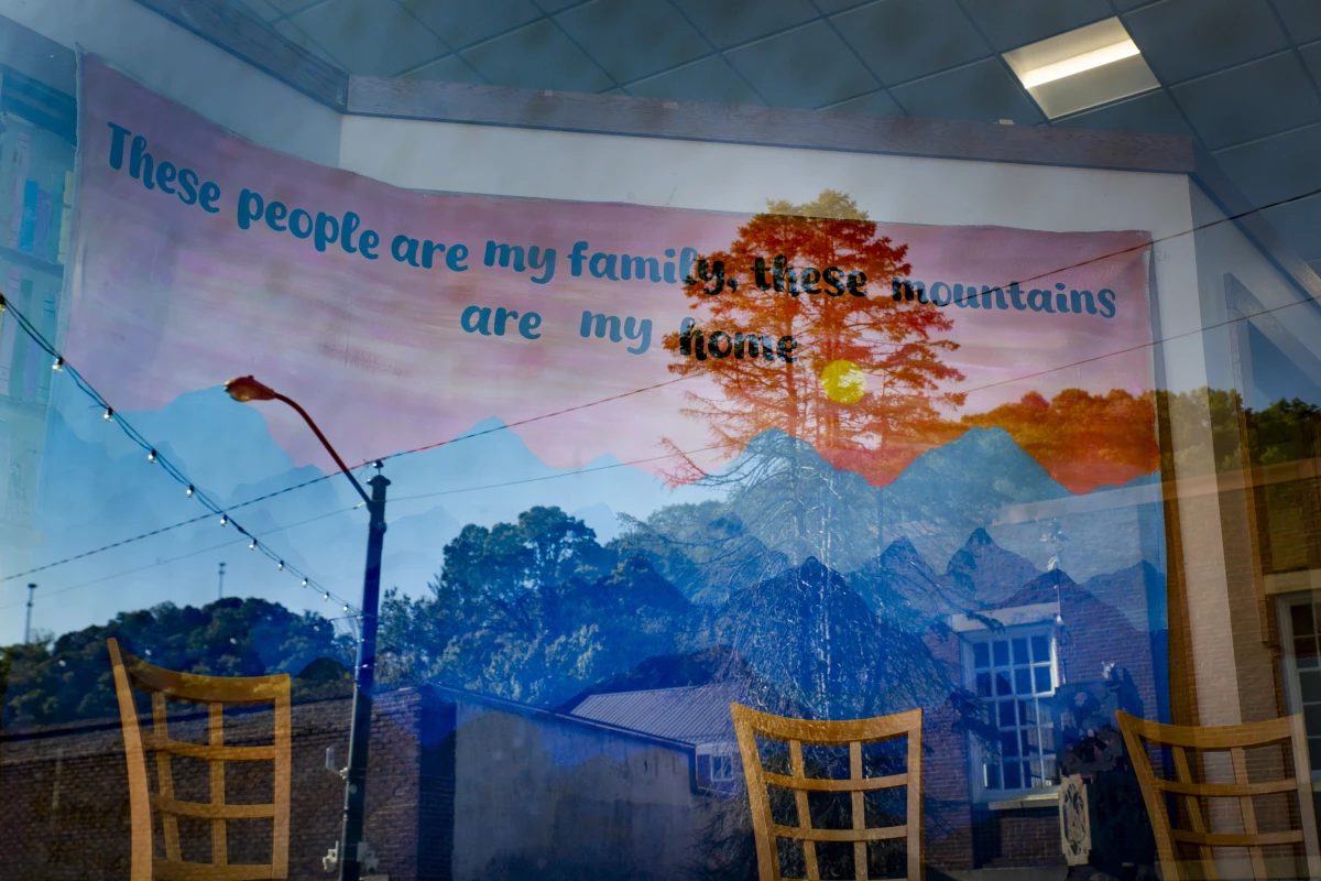A mural inside the Letcher County Public Library in Whitesburg, Ky., reads, “These people are my family, this mountains are my home.”