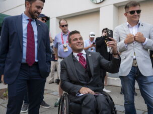 Former North Carolina Republican U.S. Rep. Madison Cawthorn (center), seen here in 2024, is now running for Congress in Florida.