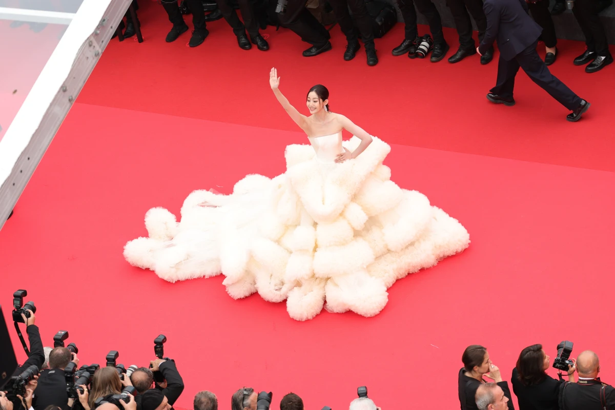 Cannes officials updated the film festival's dress code this year to ban full nudity and 'voluminous' clothing. Above, actor Wan QianHui arrives for the opening ceremony on Tuesday.