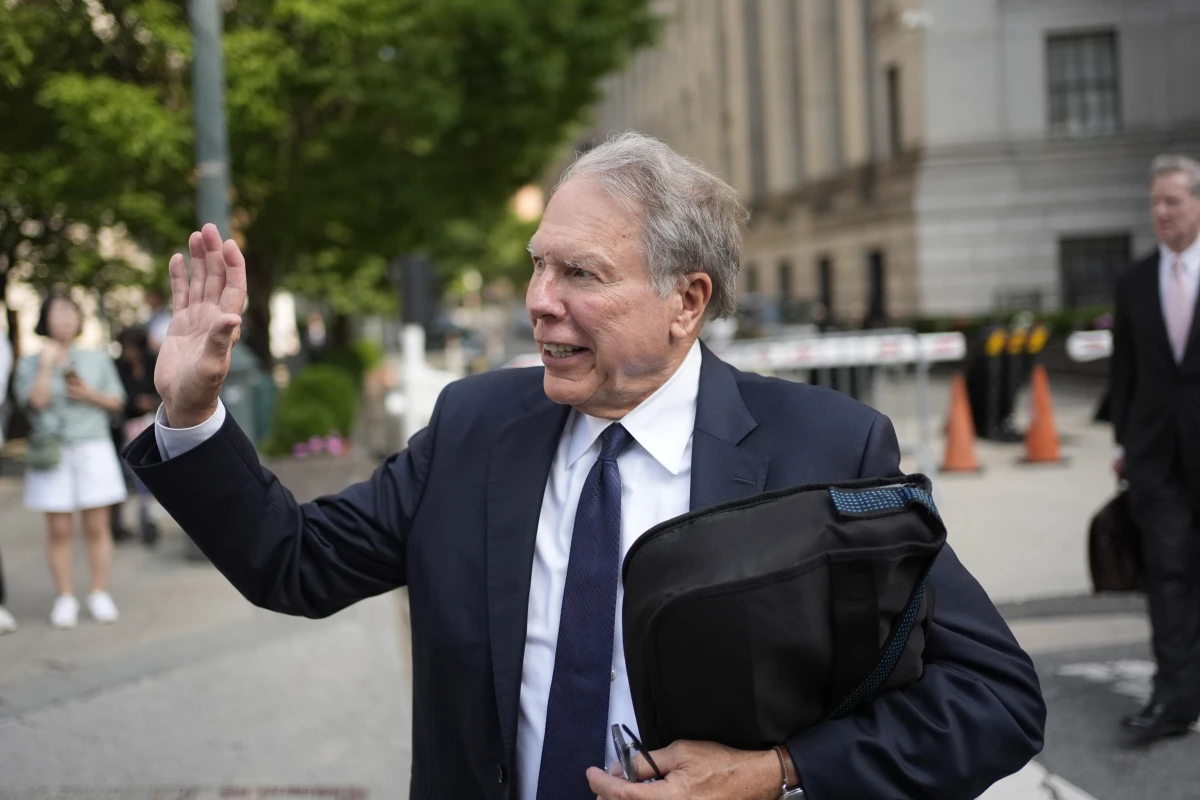 Wayne LaPierre, former CEO of the National Rifle Association, waves to someone as he leaves a courthouse in New York, Monday, July 29, 2024. A New York judge declined to appoint an outside monitor to oversee the finances and internal policies of the National Rifle Association. But he said he would bar LaPierre, the group's former leader, from holding a paid position in the organization for a decade.