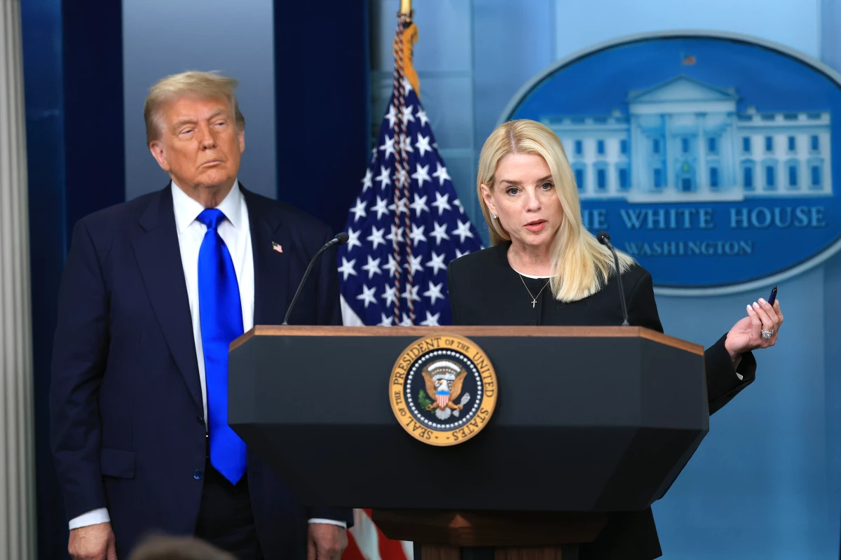 Attorney General Pam Bondi speaks alongside President Trump in the briefing room at the White House in June 2025 in Washington, D.C.