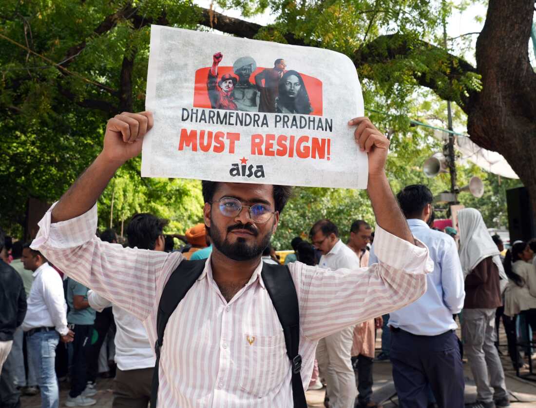 Mohammad Arshad holds a sign during the protest at Jantar Mantar on June 25, in New Delhi.