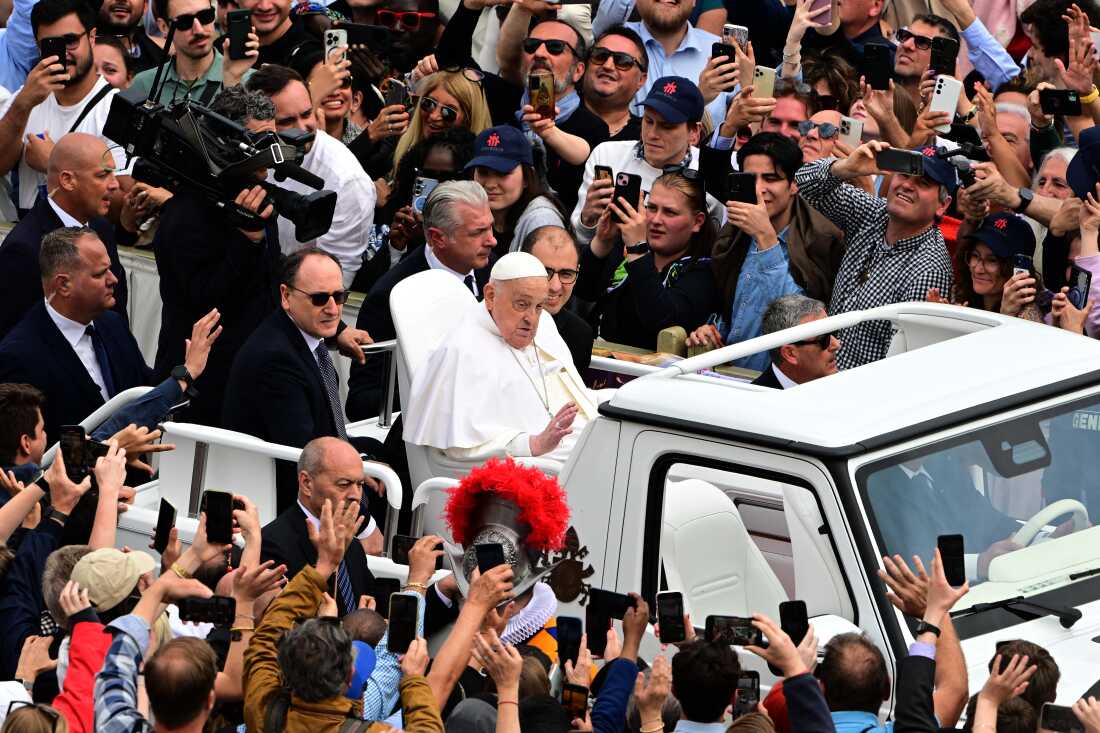 Pope Francis waves to the crowd from the popemobile after the Easter mass at St Peter's Square in the Vatican on Sunday.