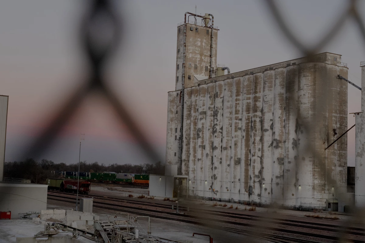 A factory plant sits next to a bridge toward downtown in Fremont, Neb.