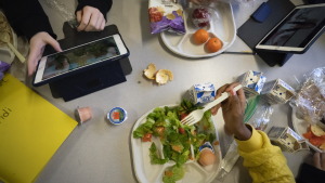 Seventh graders sit together in the cafeteria during their lunch break at a public school on Feb. 10, 2023, in Brooklyn, New York.