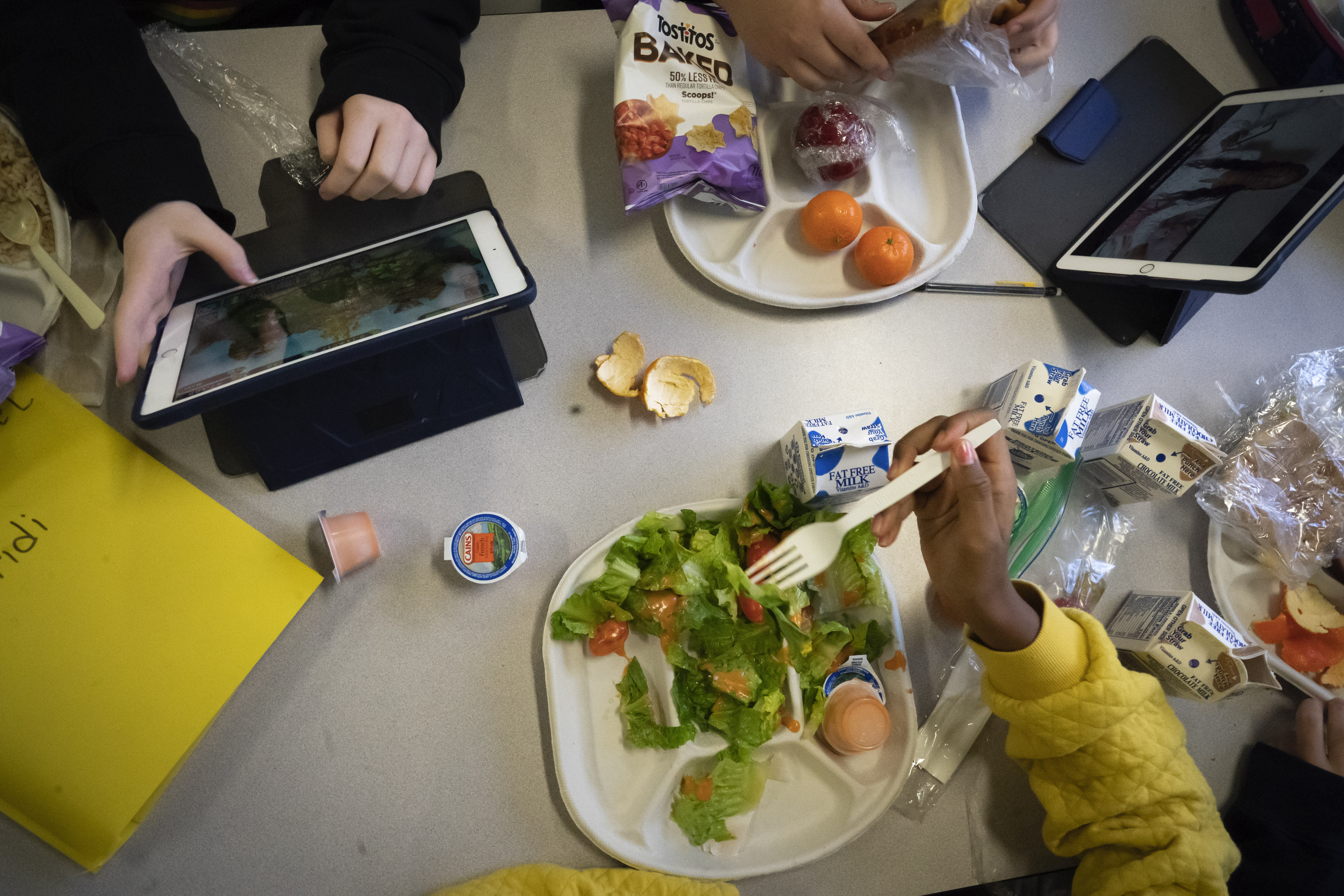 Seventh-graders sit together in the cafeteria during their lunch break at a public school in Brooklyn, N.Y., on Feb. 10, 2023. (AP)