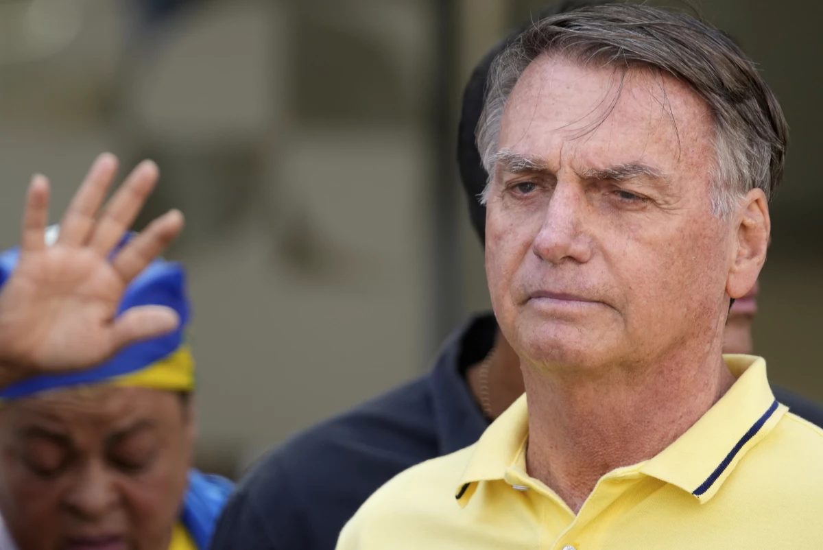 Brazil's former President Jair Bolsonaro, temporarily allowed out of house arrest for medical exams, leaves a hospital in Brasília, Brazil, Saturday, Aug. 16, 2025. (AP Photo/Eraldo Peres)