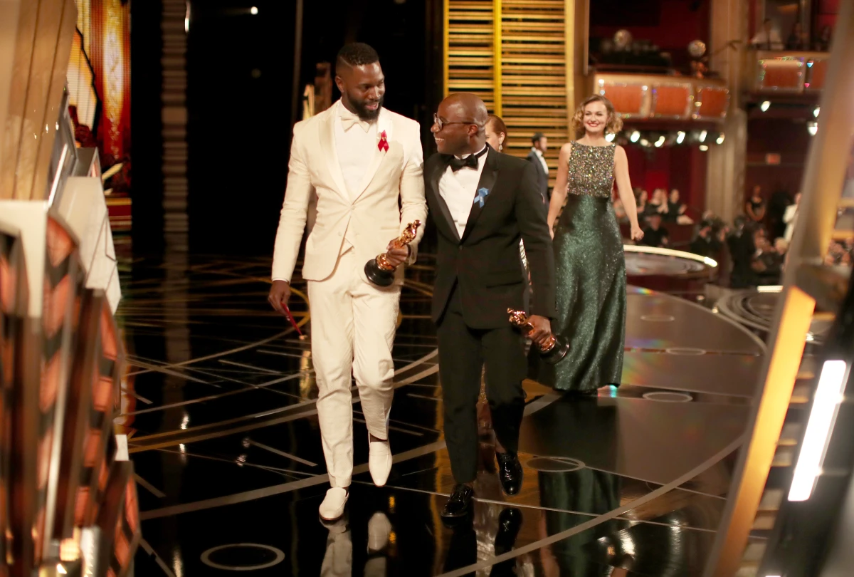 Screenwriter Tarell Alvin McCraney (left) and writer/director Barry Jenkins (right) accept the Best Adapted Screenplay award for 'Moonlight' onstage during the 89th Annual Academy Awards at Hollywood & Highland Center on February 26, 2017 in Hollywood, California.