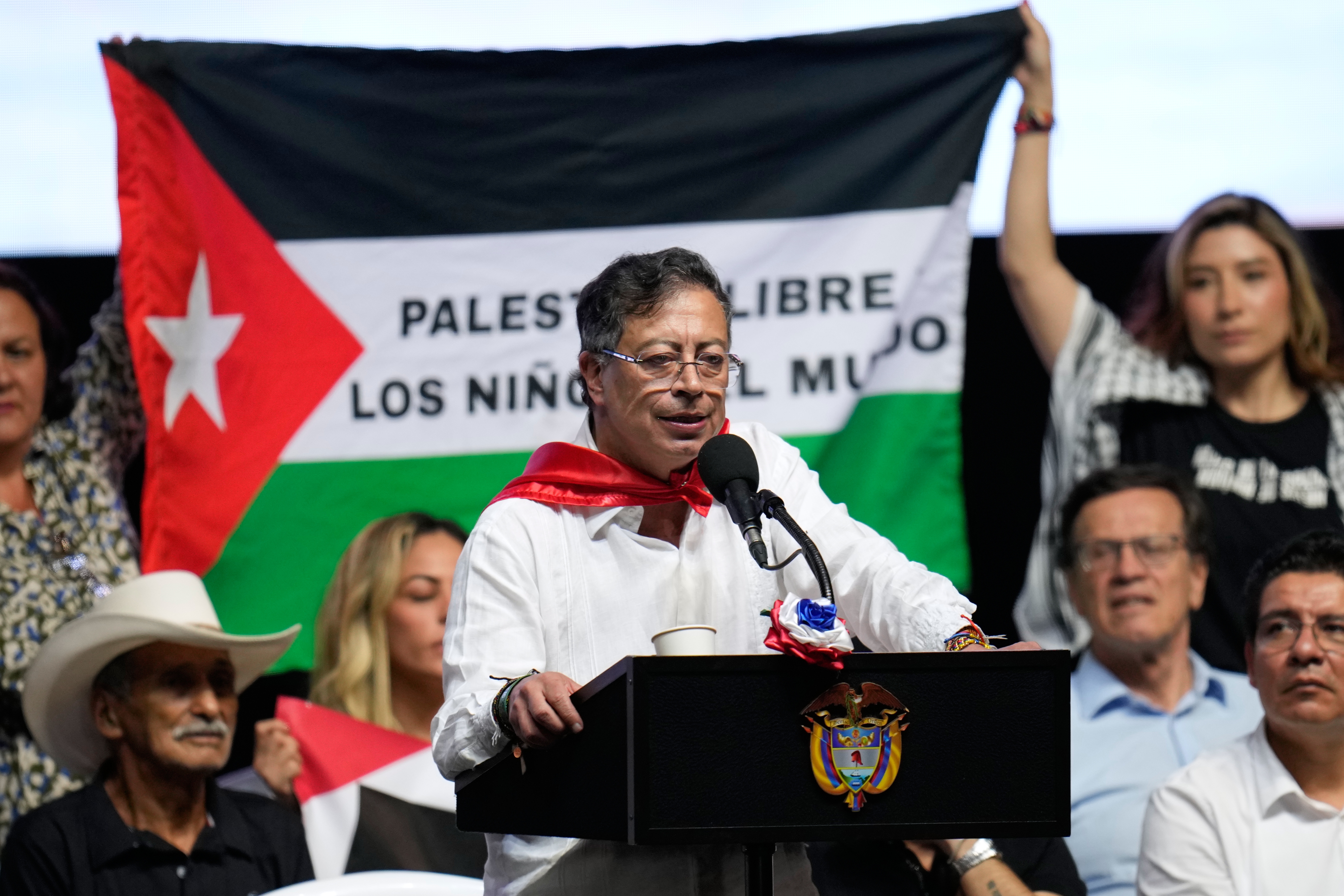 Supporters of Colombian President Gustavo Petro display a Palestinian flag as he addresses a rally in Ibague, Colombia, Oct. 3, 2025. (AP)
