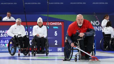 American Steve Emt competes in Sunday's mixed doubles match against Italy, which the U.S. won.