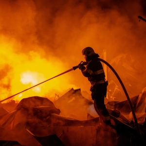 Firefighters put out a fire after Russian missiles hit a warehouse in Kyiv, Ukraine, Wednesday, Aug. 5, 2026.