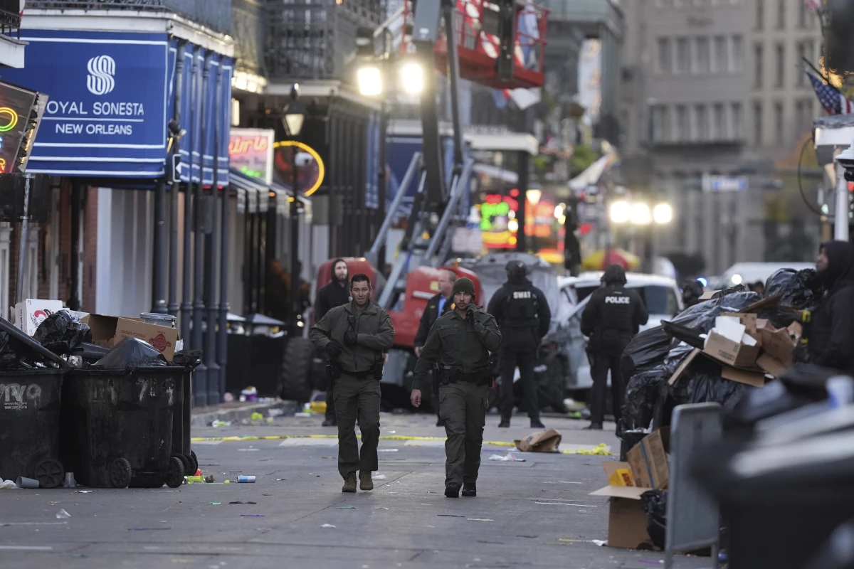 Emergency services attend the scene after a vehicle drove into a crowd on New Orleans' Canal and Bourbon Street.