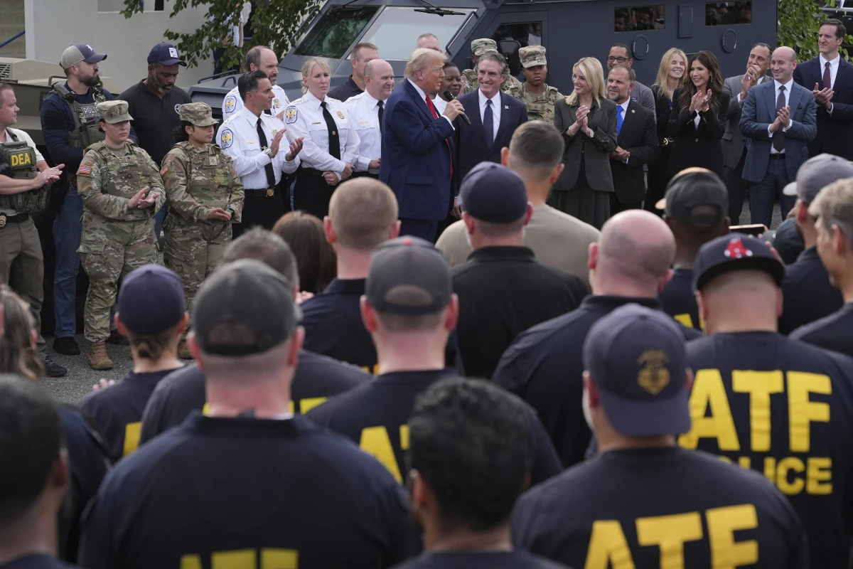 President Donald Trump speaks with members of law enforcement and National Guard soldiers on Aug. 21, 2025, in Washington.