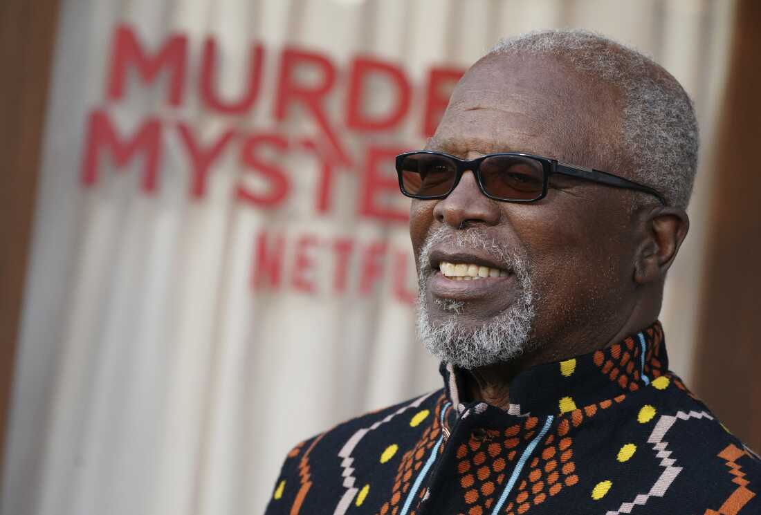 John Kani arrives at the premiere of "Murder Mystery 2" on Tuesday, March 28, 2023, at the Regency Village Theatre in Los Angeles.