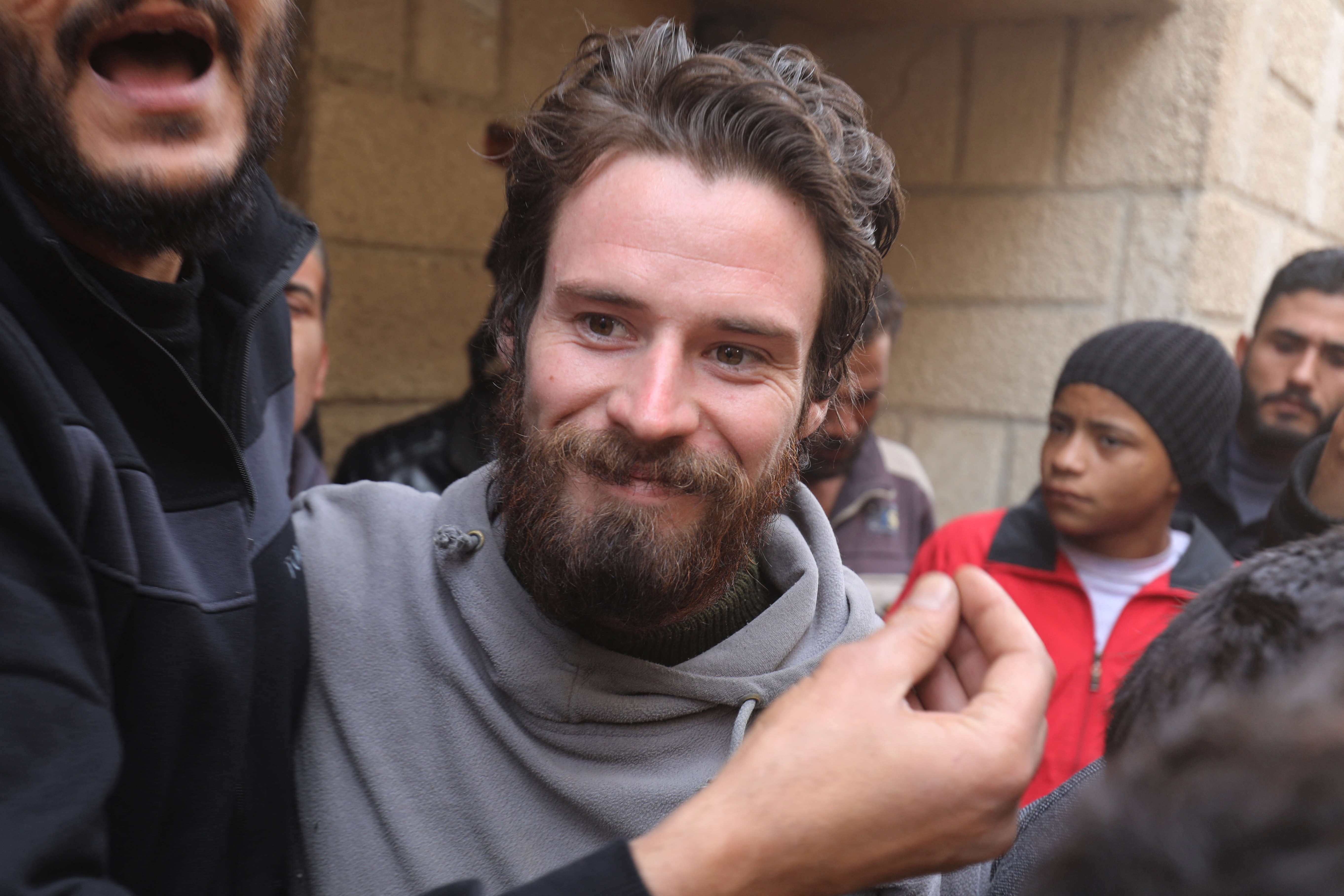 Travis Timmerman, a U.S. citizen who had entered Syria from Lebanon on a Christian pilgrimage and had been detained for several months, speaks with reporters in Damascus on Thursday, after he was found in the village of Thihabiyeh east of the capital following the fall of longtime Syrian President Bashar al-Assad.