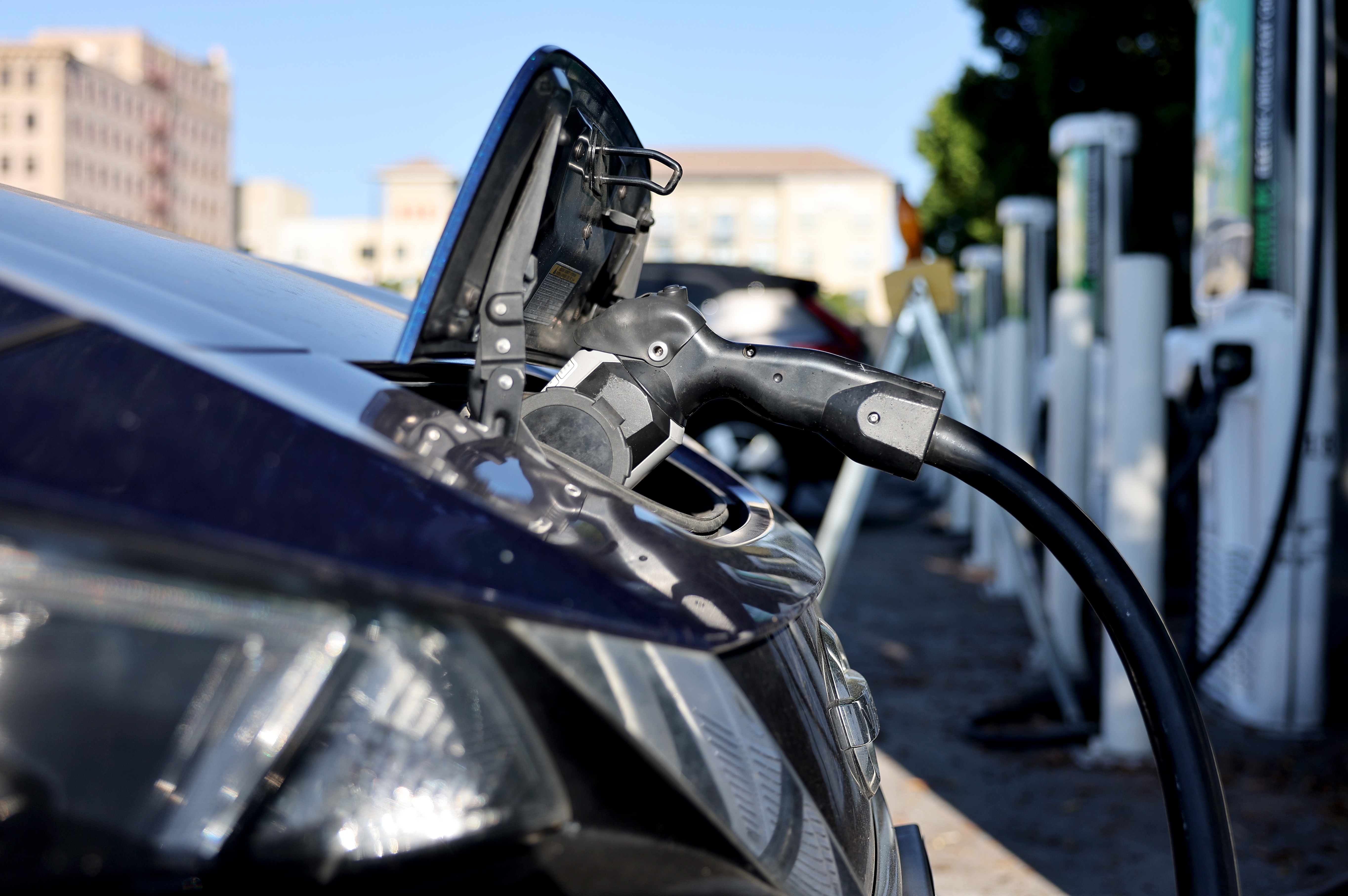 A Nissan LEAF recharges at a station in Pasadena, Calif. Memos obtained by NPR show a key federal agency has paused orders of zero-emission vehicles and some federally-owned EV chargers will be shut off.
