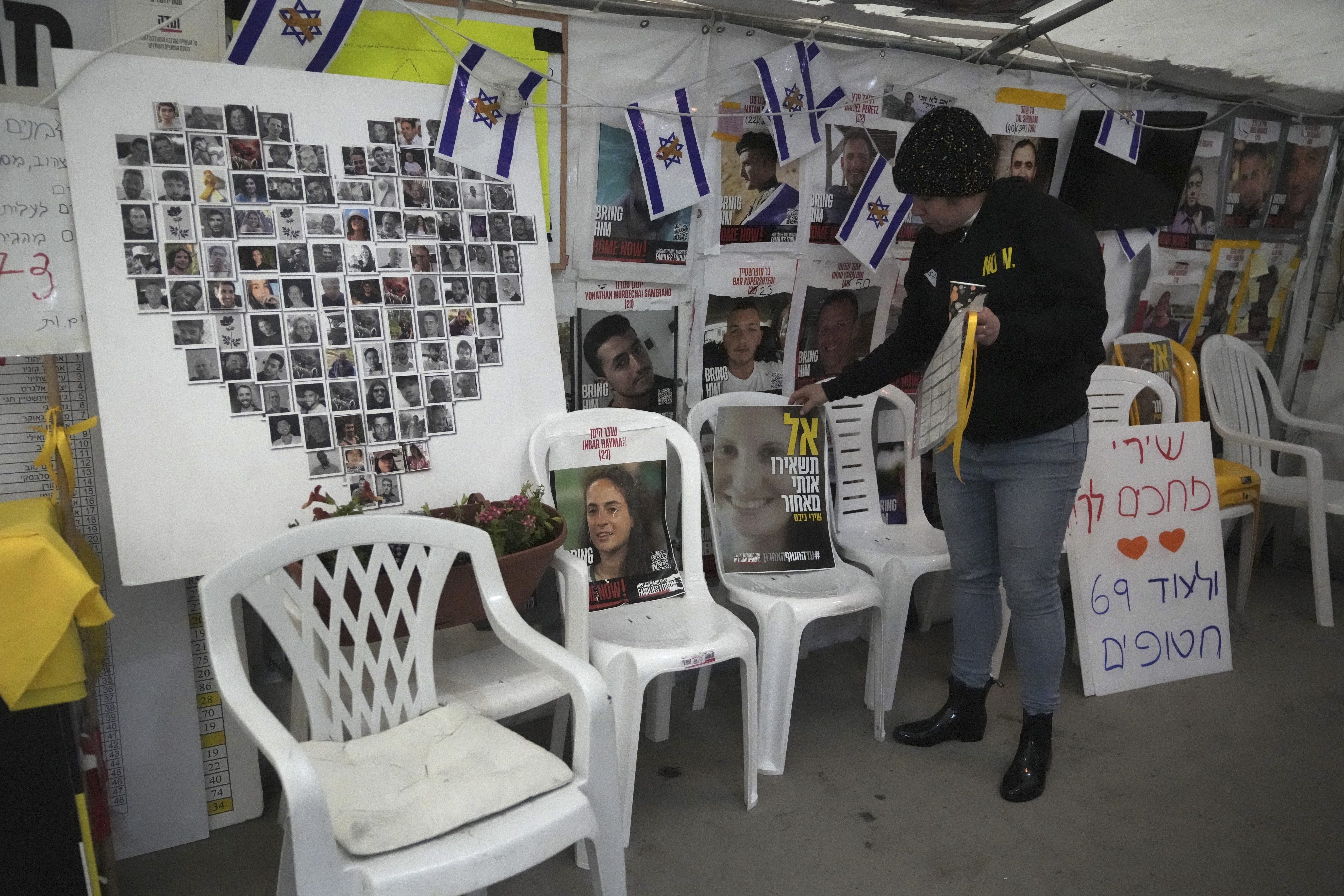A poster shows Shiri Bibas, center, who was kidnapped to Gaza with her husband and two young sons on Oct. 7, 2023, in Jerusalem on Friday. (AP)