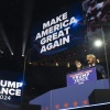 Harris is on a 2-day Georgia bus tour. It’s the latest sign the state is in play 7 This photo shows former President Donald Trump standing at a lectern and speaking into a microphone. A large screen above him says
