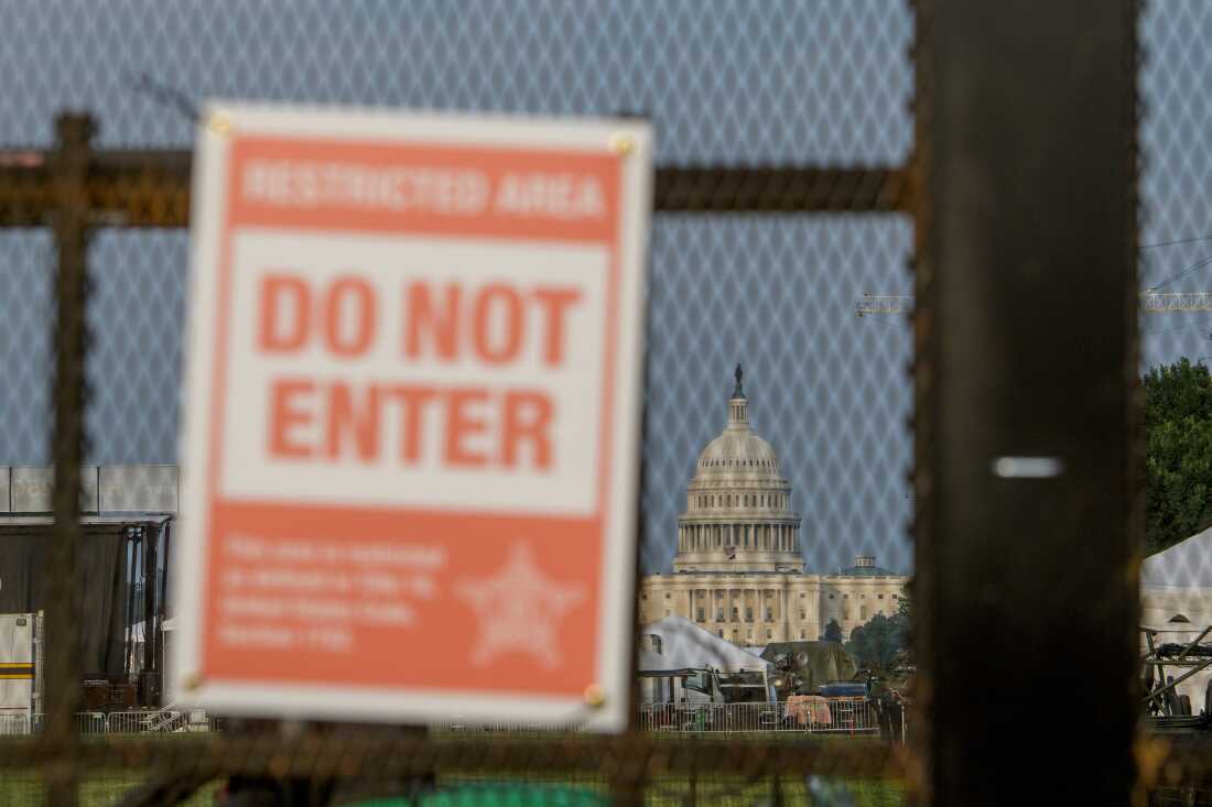 The U.S. Capitol is seen through security fencing, set up on the National Mall, during preparations for an upcoming military parade commemorating the Army's 250th anniversary and coinciding with President Donald Trump's 79th birthday, Thursday, June 12, 2025, in Washington.