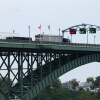 Tractor trailers cross the Peace Bridge at the Canada-United States border in Fort Erie, Ontario, Canada, on August 20.