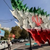 Traffic in Tehran on Wednesday moves past an installation depicting butterflies forming the Iranian national flag.