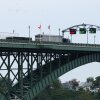Tractor trailers cross the Peace Bridge at the Canada-United States border in Fort Erie, Ontario, Canada, on August 20.