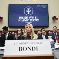 Attorney General Pam Bondi takes her seat before testifying before the House Judiciary Committee on Feb. 11.