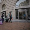 Former U.S. Agency for International Development employees terminated after the Trump administration effectively dismantled the agency collect their personal belongings at USAID headquarters on Feb. 27 in Washington, D.C.