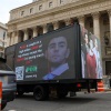 A truck displays pictures of Luigi Mangione on April 25, 2025 in New York City, as he was set to appear for the arraignment on charges that he murdered the CEO of UnitedHealthcare last year.