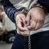 In this handout photo provided by the Salvadoran government, a close view of handcuffs placed on the hands of a newly admitted inmate allegedly linked to criminal organizations at CECOT on March 16, 2025 in Tecoluca, El Salvador. Trump's administration managed to deport some people to El Salvador under the Alien Enemies Act, the same day a judge ordered deportations under the Act paused.