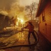 A firefighter battles the Eaton Fire on Wednesday, January 8, 2025, in Altadena, California. 