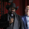 John Boyd Jr., left, and filmmaker Josh Tickell speak at the Washington premiere of “Common Ground” on Nov. 13, 2023. Boyd is a fourth-generation Virginia farmer and president of the National Black Farmers Association.